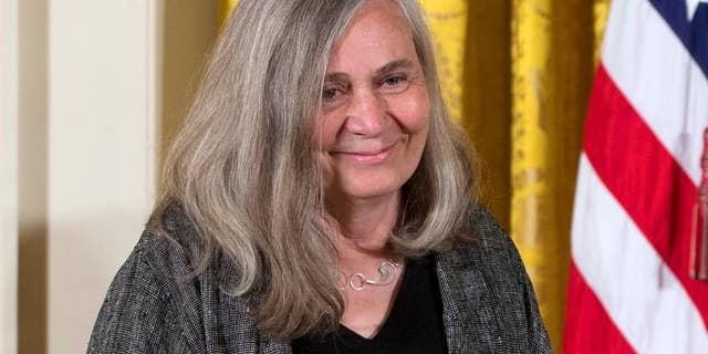 FILE - In this July 10, 2013, file photo, Marilynne Robinson appears at a ceremony awarding her the 2012 National Humanities Medal for grace and intelligence in writing in the East Room of White House in Washington. Robinson, the acclaimed author of such novels as “Gilead” and “Housekeeping,” is this year’s winner of the Library of Congress Prize for American Fiction, a lifetime achievement honor. (AP Photo/Carolyn Kaster, File)