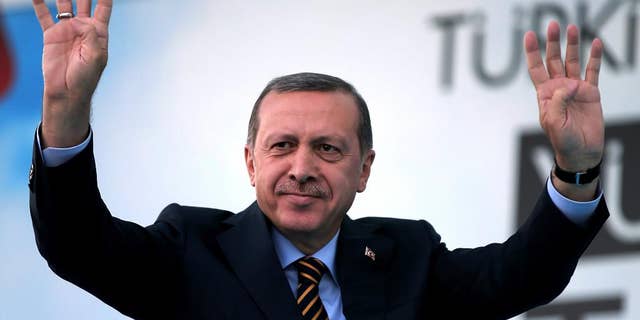 Turkish Prime Minister and presidential candidate of the ruling party in the August election, Recep Tayyip Erdogan waves to his supporters in Istanbul, Turkey, Friday July 25, 2014. (AP Photo/Emrah Gurel)