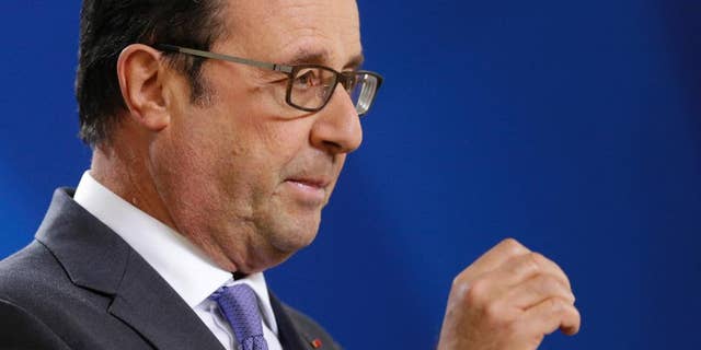 French President Francois Hollande answers a question from the media during the final press briefing at the EU Summit in Brussels, Friday, Oct. 21, 2016. France warned British Prime Minister Theresa May at her maiden European Union summit that she would face a tough, unyielding bloc if she sought too many concessions during the negotiations to leave the 28-nation EU. (AP Photo/Alastair Grant)