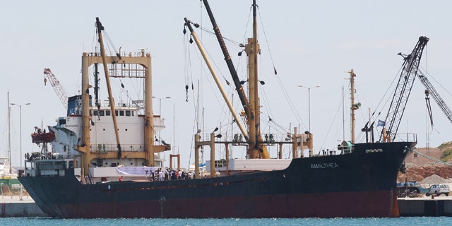 July 9: The cargo ship Al Amal, chartered by a Libyan charity run by Muammar al-Qaddafi's son to break Israel's naval blockade of Gaza and deliver about 2,000 tons of aid, is seen loading up in a Greek port.