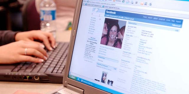 An unidentifed University of Missouri student looks through Facebook while in class Wednesday, Feb. 22, 2006, on the Columbia, Mo. campus. Facebook, a popular online social network for students, has drawn the attention of several schools administrators and prospective employers to see what students are up to. (AP Photo/L.G. Patterson)