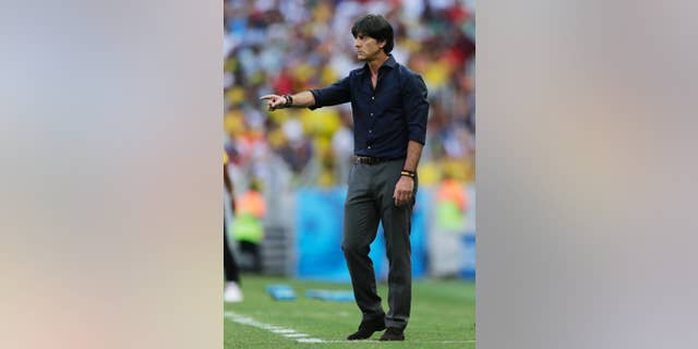 Germany's head coach Joachim Loew gestures during the group G World Cup soccer match between Germany and Ghana at the Arena Castelao in Fortaleza, Brazil, Saturday, June 21, 2014. (AP Photo/Matthias Schrader)