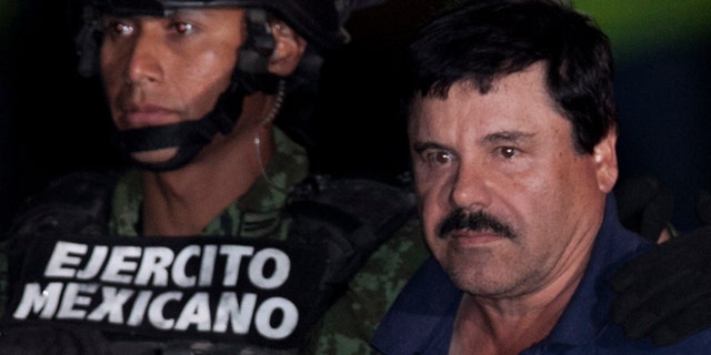 Joaquín Guzmán is escorted by soldiers and marines in Mexico City, Friday, Jan. 8, 2016.