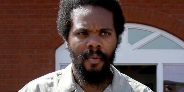 FILE - In this May 5, 2014 file photo is Cornealious "Mike" Anderson in Charleston, Mo. Prosecutors said Thursday, Feb. 6, 2015 they have dropped purse-snatching charges against Anderson after an investigation by their office cast doubt on the case. Anderson drew national attention in 2013 when he was imprisoned after prison officials found a mistake that allows him to avoid prison for 13 years for a robbery conviction. He was released after 10 months. (AP Photo/Jeff Roberson, File)
