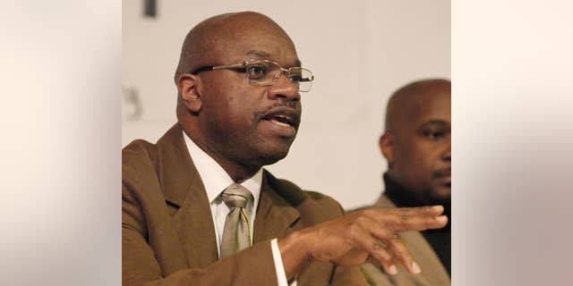 FILE - In this Feb. 10, 2011 file photo, Chicago Alderman Willie Cochran, left, address the residents of the 20th Ward in Chicago. Cochran, a prominent Chicago alderman indicted on federal corruption charges, is due for his first court appearance. Cochran has been charged in a 15-count indictment, including allegations that he extorted money from a liquor store owner and pilfered funds from a local government activities fund to pay for gambling and his daughter's college tuition. His arraignment in federal court is Friday, Dec. 24, 2016, morning. (AP Photo/Charles Rex Arbogast, File)