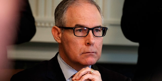 EPA administrator Scott Pruitt listens as President Trump speaks during a cabinet meeting at the White House.