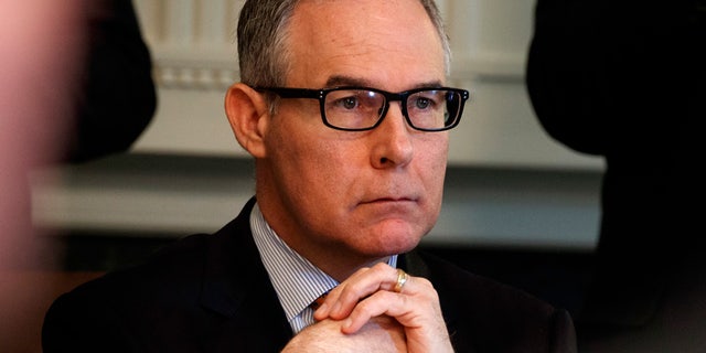 EPA administrator Scott Pruitt listens as President Trump speaks during a cabinet meeting at the White House.