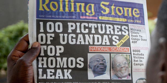 A Ugandan man reads the headline of the Ugandan newspaper "Rolling Stone" in Kampala, Uganda. Tuesday, Oct. 19, 2010, in which the papers reveals the identity of allegedly gay members of Ugandan society and calls for public punishment against those individuals.