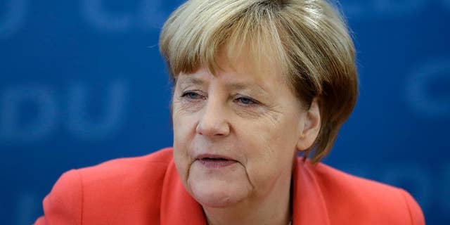 German Chancellor Angela Merkel waits for the beginning of a board meeting of the Christian Democratic party CDU in Berlin, Germany, Monday, Sept. 19, 2016, the day after Merkel's party endured a second setback in a state election in two weeks, as many voters turned to the left and right in Berlin. (AP Photo/Michael Sohn)