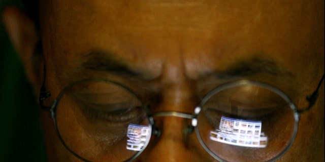 Sept. 27, 2012: A Vietnamese man logs onto the Internet on his iPad in Hanoi, Vietnam.