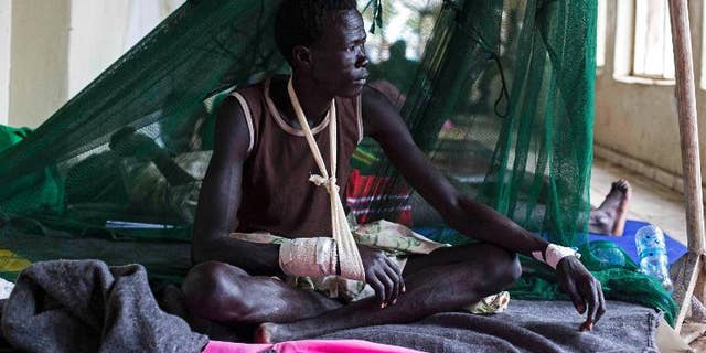 A man injured during tribal clashes sits in a hospital in Bor, South Sudan on July 15.