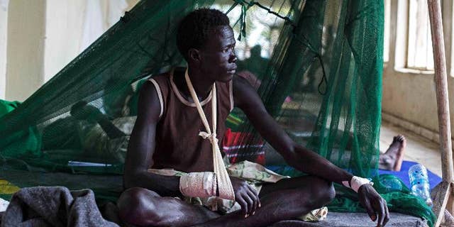 A man injured during tribal clashes sits in a hospital in Bor, South Sudan on July 15.