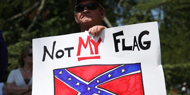 COLUMBIA, SC - JUNE 23: John Calef attends a protest in support of a Confederate flags removal from the South Carolina capitol grounds on June 23, 2015 in Columbia, South Carolina. The South Carolina governor Nikki Haley asked that the flag be removed after debate over the flag flying on the capitol grounds was kicked off after nine people were shot and killed during a prayer meeting at the Emanuel African Methodist Episcopal Church in Charleston, South Carolina. (Photo by Joe Raedle/Getty Images)