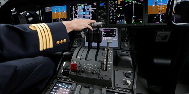 File photo: An Air France pilot stands in the cockpit of the airline's new Boeing Inc. 787-9 Dreamliner passenger aircraft as it stands on the tarmac at Charles de Gaulle Airport in Roissy, France, December 2, 2016. (REUTERS/Benoit Tessier)