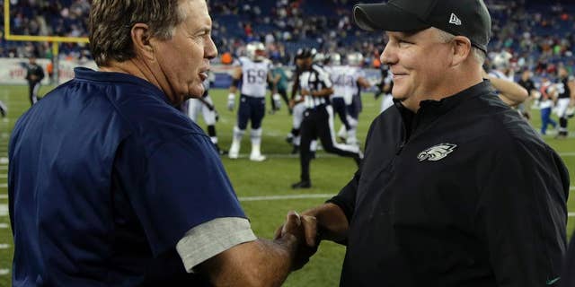 New England Patriots coach Bill Belichick, left, shakes hands with Philadelphia Eagles coach Chip Kelly after an NFL preseason football game Friday, Aug. 15, 2014, in Foxborough, Mass. The Patriots won 42-35. (AP Photo/Charles Krupa)