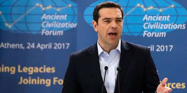 Greek Prime Minister Alexis Tsipras delivers a speech during the "Ancient Civilizations Forum" (ACForum) at Zappeio Conference Hall in Athens, Monday, April 24, 2017. Foreign Ministers and top officials from various countries attended the forum being held in the Greek capital. (AP Photo/Thanassis Stavrakis)
