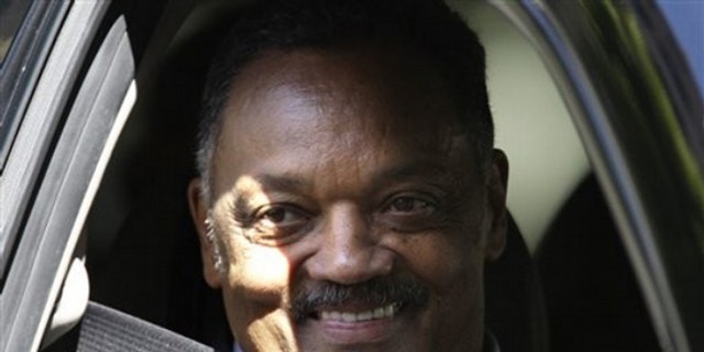Rev. Jesse Jackson smiles at fans as he departs the Beverly Wilshire Hotel, Tuesday, July 7, 2009 in Beverly Hills after attending the Michael Jackson memorial in Los Angeles at the Staples Center. (AP Photo/Carolyn Kaster)