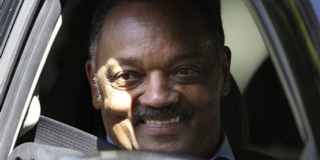 Rev. Jesse Jackson smiles at fans as he departs the Beverly Wilshire Hotel, Tuesday, July 7, 2009 in Beverly Hills after attending the Michael Jackson memorial in Los Angeles at the Staples Center. (AP Photo/Carolyn Kaster)