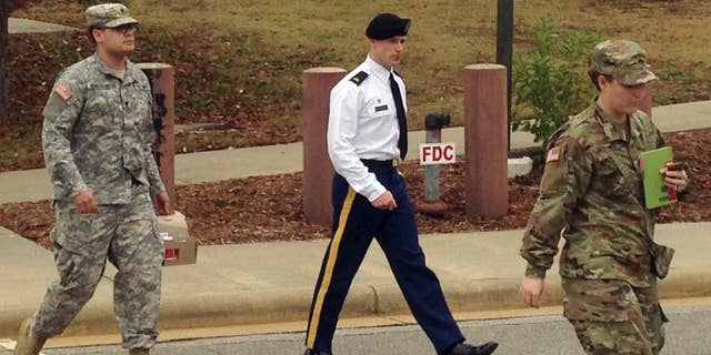 Army Sgt. Bowe Bergdahl is seen leaving a courtroom after a pretrial hearing in Fort Bragg, NC., Monday, Nov. 14, 2016. Bergdahl faces a military trial in 2017 on charges of desertion and misbehavior before the enemy after walking off his post in Afghanistan in 2009. (AP Photo/Jonathan Drew)