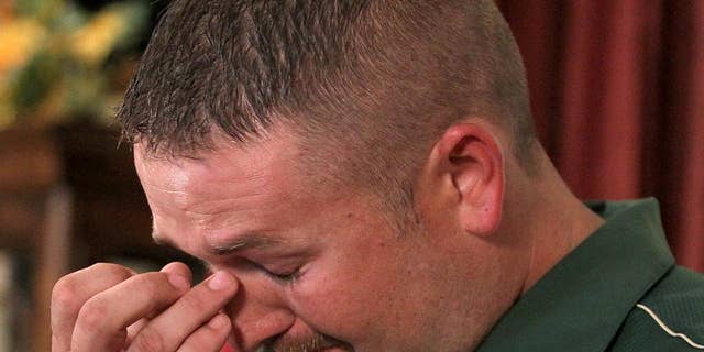 FILE - In this June 15, 2015 file photo, Matthew Clendennen wipes away tears in Hewitt, Texas. as he address the media about the Twin Peaks biker shootout and how its affected his life. A Texas appeals court on Friday, Aug. 7, 2015 reversed a gag order in a criminal case arising from a shootout saying the Waco court had abused its discretion in the case of Clendennen, the only arrested biker who has filed a lawsuit against local authorities alleging that he was arrested without probable cause. (Jerry Larson/Waco Tribune Herald via AP, File)