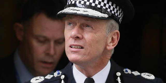 FILE - In this Thursday, May 23, 2013 file photo, the Commissioner of the London Metropolitan Police Bernard Hogan-Howe leaves 10 Downing Street in London. British police on Monday, March 16, 2015, arrested an 18-year-old suspected of planning to travel to join Islamic State militants in Syria, hours after three other U.K. teens detained in Turkey were released on bail. The arrests are signs of increasingly strenuous efforts by police to stop the flow of radicalized young Britons to the Middle East. Detectives have been criticized for failing to prevent three 15- and 16-year-old London girls from making the same journey last month. Metropolitan Police Commissioner Bernard Hogan-Howe has said the girls would not be charged with terrorism offenses if they came home. (AP Photo/Alastair Grant, File)