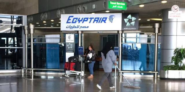 FILE - In this Thursday, May 19, 2016, file photo, the Egyptair logo is seen at the arrivals section of Cairo International Airport, Egypt. Egyptian Aviation officials said on Sunday they would soon announce a tender for a new security system for Cairo airport employees involving retina scans, attempting to meet a key Russian condition to resume flights to Egypt.  (AP Photo/Amr Nabil, File)