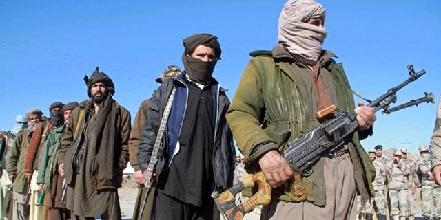 January 30, 2012: Taliban militants hand over their weapons after joining the Afghan government's reconciliation and reintegration program, in Heart.