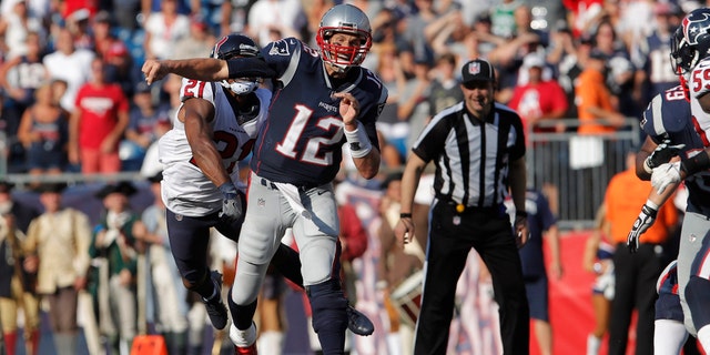 Sep 24, 2017; Foxborough, MA, USA; Houston Texans defensive back Marcus Gilchrist (21) hits the arm of New England Patriots quarterback Tom Brady (12) in the second half at Gillette Stadium. Mandatory Credit: David Butler II-USA TODAY Sports - 10304422