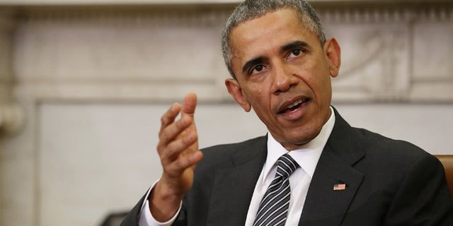WASHINGTON, DC - FEBRUARY 17: U.S. President Barack Obama (C) talks to reporters at the end of a meeting with newly sworn-in Defense Secretary Ashton Carter in the Oval Office at the White House February 17, 2015 in Washington, DC. Obama said he rejects a federal judge's last-minute ruling that halts his executive order on immigration and said his administration will appeal. "The law is on our side and history is on our side," Obama said. (Photo by Chip Somodevilla/Getty Images)
