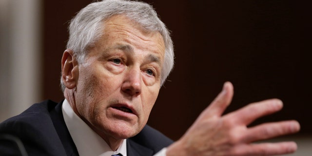 FILE - In this Jan. 31, 2013 file photo, former Nebraska Republican Sen. Chuck Hagel testifies on Capitol Hill in Washington before the Senate Armed Services Committee confirmation hearing. When President Barack Obama declared Hagel would be the first former enlisted man to lead the Pentagon, he seemed to overlook four previous defense chiefs who served at least part of their military years as enlisted men. (AP Photo/J. Scott Applewhite, File)