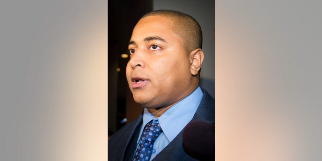 Miami Dolphins lineman Jonathan Martin speaks to members of the media outside the office of the NFL lawyer investigating the team's bullying scandal, Friday, Nov. 15, 2013, in New York. The league is trying to gather information about the harassment Martin says he was subjected to by teammate Richie Incognito. (AP Photo/John Minchillo)