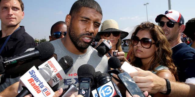 Houston Texans running back Arian Foster answers questions from reporters after an NFL football training camp practice Thursday, Aug. 14, 2014, in Houston. (AP Photo/David J. Phillip)