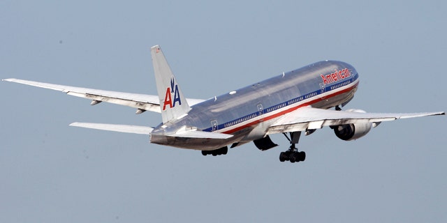 FILE -An American Airlines airplane takes off at Miami International Airport in Miami.