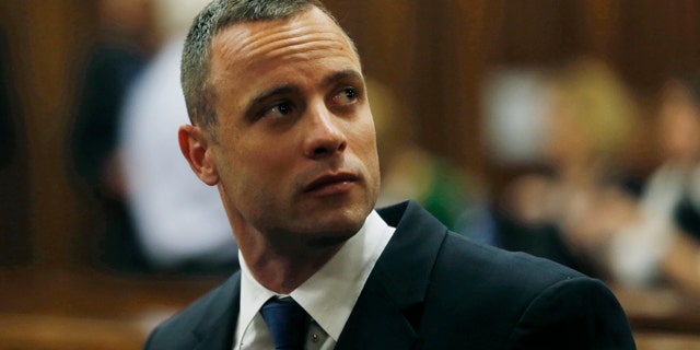 May 6, 2014: Oscar Pistorius is seated in a courtroom at the high court in Pretoria, South Africa. (AP Photo/Mike Hutchings, Pool)