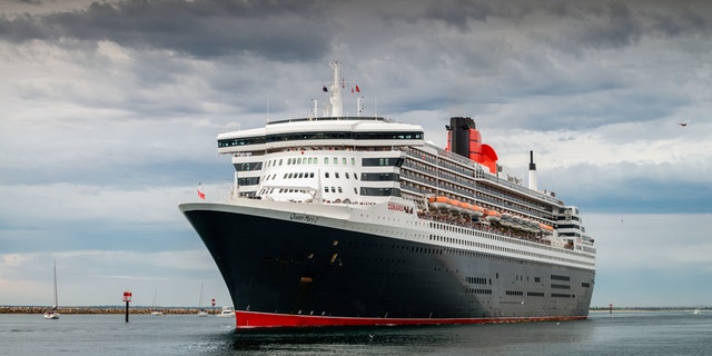 Adelaide, Australia - March 10, 2014: RMS Queen Mary 2 with people on board is leaving for cruise from Outer Harbour in Port Adelaide, South Australia