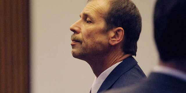 Theodore Wafer pauses at the end of Day 3 of his trial, Monday, July 28, 2014, Detroit, Mich. Wafer is the Dearborn Heights homeowner charged in the shooting death of Renisha McBride. (AP Photo/The Detroit News, Clarence Tabb Jr.)