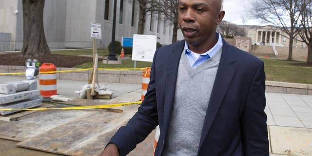 FILE - In this Feb. 2, 2015 file photo, basketball analyst Greg Anthony leaves the D.C. Superior Court in Washington. Anthony will have a soliciting prostitution charge dropped if he does 32 hours of community service and stays out of trouble for four months. Anthony, his attorney and a prosecutor told a judge Wednesday that they had agreed to the deal, called a deferred prosecution agreement. (AP Photo/Cliff Owen, File)