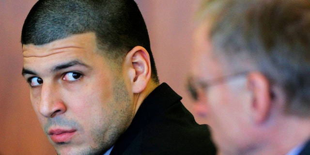 FILE - In this Dec. 22, 2014 file photo, former New England Patriots tight end Aaron Hernandez, left, attends a pretrial hearing in Fall River, Mass. Hernandez is accused of murdering semi-professional football player Odin Lloyd. A jury is expected to be seated for opening arguments in his murder trial as early as Tuesday, Jan. 27, 2015. Judge Susan Garsh had cleared 53 potential jurors after individually questioning them to weed out people who are biased, have a hardship or have a valid reason to be excused. Lawyers from both sides will have the chance to eliminate 18 people each from the final pool on Monday for any reason. Eighteen jurors will be seated. (AP Photo/Brian Snyder, Pool, File)