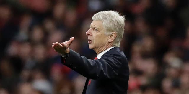 FILE - In this Saturday, Oct. 22, 2016 file photo, Arsenal's manager Arsene Wenger gestures during the English Premier League soccer match between Arsenal and Middlesbrough at the Emirates Stadium in London. The English Football Association has banned Arsenal manager Arsene Wenger from the touchline for four matches after an altercation with a match official. Wenger escaped a stadium ban for shoving fourth official Anthony Taylor in the tunnel area at Emirates Stadium on Sunday, Jan. 22, 2017 during Arsenal's 2-1 victory over Burnley in the Premier League. (AP Photo/Matt Dunham)