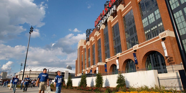 Sept. 7, 2008: Fans pass the new home of the Indianapolis Colts, Lucas Oils Stadium.