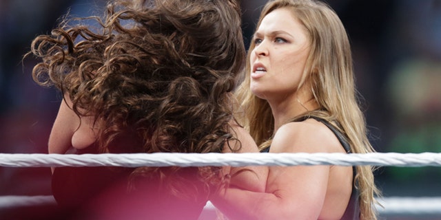 IMAGE DISTRIBUTED FOR WWE - UFC fighter Ronda Rousey makes a surprise appearance at WrestleMania 31 on Sunday, March 29, 2015 at Levi's Stadium in Santa Clara, CA. WrestleMania broke the Leviâs Stadium attendance record at 76,976 fans from all 50 states and 40 countries. (Don Feria/AP Images for WWE)