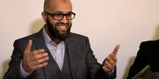 CAGE research director, Asim Qureshi talks during a press conference held by the CAGE human rights charity in London, Thursday, Feb. 26, 2015. A British-accented militant who has appeared in beheading videos released by the Islamic State group in Syria bears ìstriking similaritiesî to a man who grew up in London, a Muslim lobbying group said Thursday. Mohammed Emwazi has been identified by news organizations as the masked militant more commonly known as ìJihadi John.î London-based CAGE, which works with Muslims in conflict with British intelligence services, said Thursday its research director, Asim Qureshi, saw strong similarities, but because of the hood worn by the militant, ìthere was no way he could be 100 percent certain.î (AP Photo/Matt Dunham)