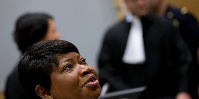 Prosecutor Fatou Bensouda of Gambia looks up as she waits for the start of the proceedings against Dominic Ongwen, a Ugandan commander in warlord Joseph Kony's feared militia, made his first appearance before judges at the International Criminal Court in The Hague, Netherlands, Monday, Jan. 26, 2015. Ongwen arrived in The Hague last week after being taken into custody in Central African Republic. He faces war crimes and crimes against humanity charges for his alleged role in a reign of terror that has spanned more than 25 years in central Africa's Great Lakes region. (AP Photo/Peter Dejong, Pool)
