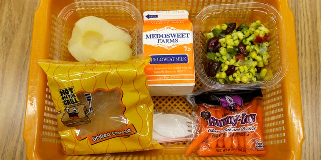 A school lunch featuring a grilled cheese sandwich.