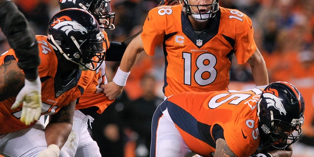 FILE - In this Sept. 23, 2013, file photo, Denver Broncos quarterback Peyton Manning (18) directs running back Knowshon Moreno (27), behind offensive lineen Orland Franklin (74) and Louis Vasquez (65), during the third quarter of an NFL football game against the Oakland Raiders in Denver. (AP Photo/Jack Dempsey, File)