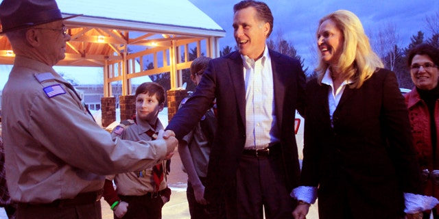 FILE: Former Massachusetts Gov. Mitt Romney and his wife, Ann, are greeted in Bartlett, N.H. on March 5.