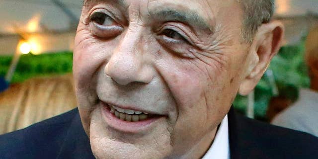 FILE - This Sept. 10, 2014, file photo shows former Providence, R.I., Mayor Buddy Cianci, who died at age 74 on Jan. 28, 2016, in Providence.  Cianci held office for more than 21 years, but was forced from his seat twice due to felonies. He left behind several ventures, including his self-branded pasta sauce, a scholarship fund and plans for a library to house 40 years’ worth of memorabilia. (AP Photo/Steven Senne, File)