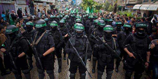 Palestinian Hamas gunmen during a rally to mark the anniversary of the Hamas terror group, in Gaza City, Gaza.