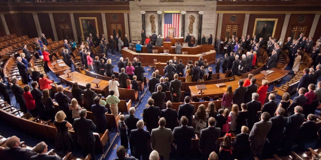 FILE -- Jan. 6, 2015: Members of the House of Representatives stand for the Pledge of Allegiance at the opening session of the 114th Congress, on Capitol Hill in Washington.
