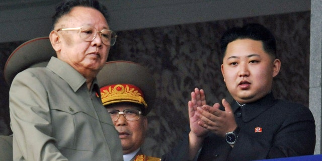 In this Oct. 10, 2010 file photo, Kim Jong Un, right, along with his father and North Korea leader Kim Jong Il, left, attend a massive military parade marking the 65th anniversary of the ruling Workers' Party in Pyongyang, North Korea.